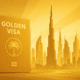 Stylised golden illustration of Dubai skyline with golden passport card representing the UAE Golden Visa program